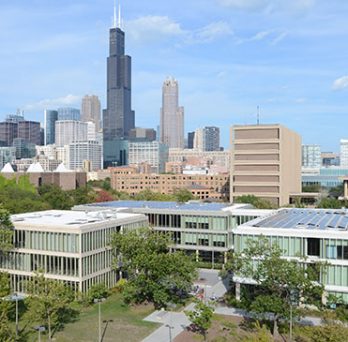 Aerial view of UIC's Douglass Hall with the Chicago skyline in the background 