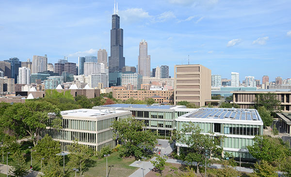 Aerial view of UIC's Douglass Hall with the Chicago skyline in the background