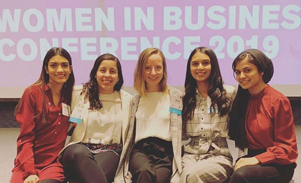 Bruna Tavares and women at the 2019 Women in Business Conference