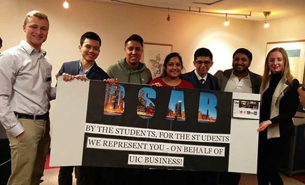 BSAB members holding a sign that reads, 