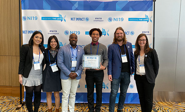 Net Impact members with their award as Net Impact 2019 Graduate Chapter of the Year Finalist