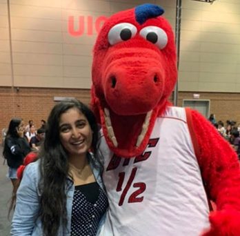 Nikhita Wadhawan with the UIC mascot, Sparky D. Dragon 