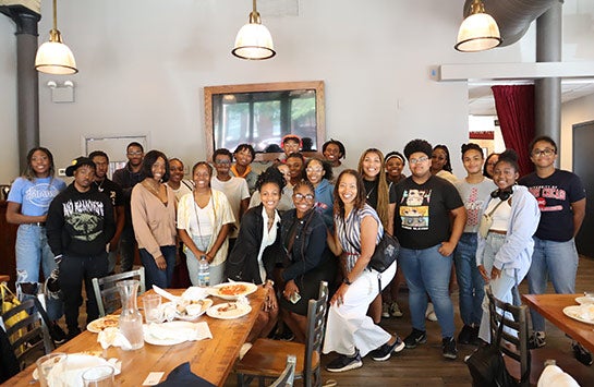 Black Emerging Leaders Academy students and staff posing for a group picture