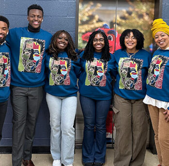 E-board members of Black Students in Business (BSIB), and advisor Kim Moon, Senior Lecturer of Marketing 