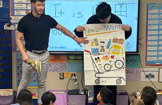 UIC Business students teaching elementary school children as part of a Junior Achievement of Chicago volunteer service project